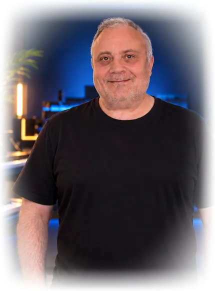 Leigh Buxton smiling in his music studio